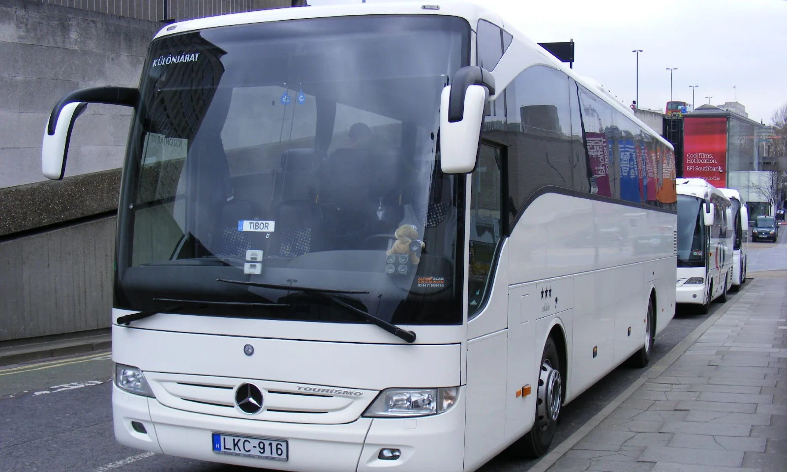 White luxury coach bus with driver for bus rental in Dubai by Diamond Bus Rental, Al Quoz